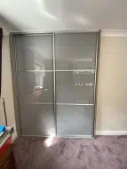 Storm grey glass with polished silver frames divided into 3, installed in West Rounton